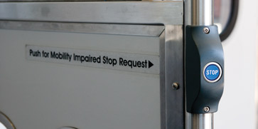 Call buttons signal the train operator for a stop request by passengers in the designated spaces.